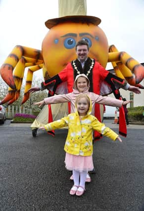 Mayor Carson and his daughters Isabella and Penelope enjoying the set-up for the Mayor's Carnival Parade and Family Fun Day.