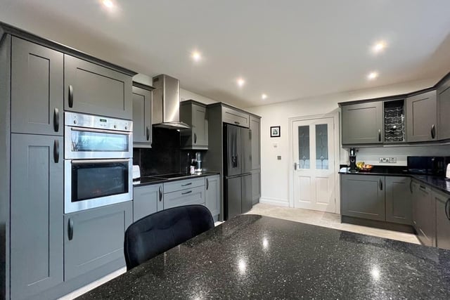 The kitchen / dining area is a stunning light filled space fitted with downlighters and tiled floor throughout. The kitchen is fitted with eye and low level units, stainless steel sink unit, breakfast bar and granite worktops and upstand. Integrated appliances are included in the sale.