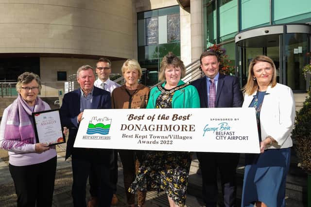 Donaghmore is celebrating winning the ‘Best of the Best Award’ at the 2022 Best Kept City, Town, Village and Housing Area Awards. Pictured are Doreen Stevens, Sammy Wilson, Mark McAdoo, Mid Ulster Council, Sheila Donaghy, Deputy Chair of Mid Ulster Council Frances Burton, Stephen Patton, Human Resources and CR Manager at George Best Belfast City Airport and Bridgeen McIlroy Executive Officer at the Northern Ireland Amenity Council. Pic: Brian Thompson Photography
