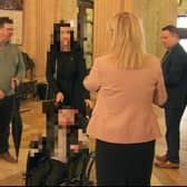 Michelle O'Neill standing a few yards from Michael McMonagle - but she says she didn't see her former employee.