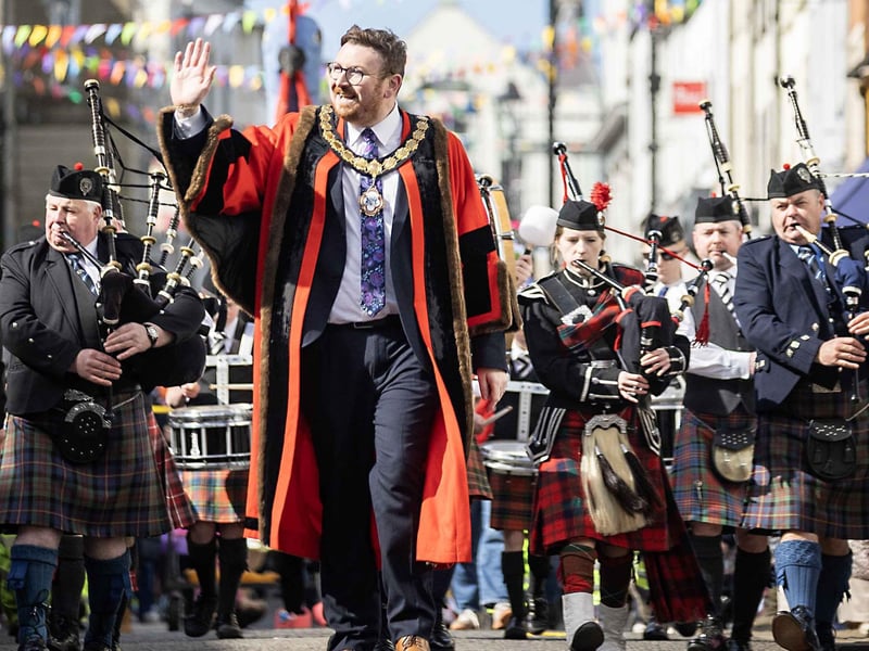 The Deputy Mayor, Alderman Richard Brown Stewart, leads the carnival parade.