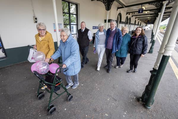 Helen Welsh, Eva Tolsen, who was celebrating her 90th birthday, Geri Doherty, Trevor Moffat, Bronagh Hoyle and Anna Kane prepare to board the Chatty Carriage in Coleraine.
