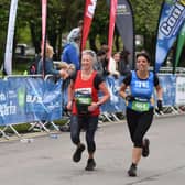 Caroline and Toni sprint to the finish line in the Belfast City Marathon.