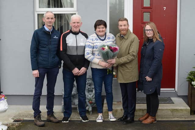 Housing Executive tenants Michael and Geraldine Crilly (middle) delight in thermal upgrade works completed at their home in McClelland Park, Dunloy with Mark Alexander, Housing Executive Causeway Area Manager, Joanne White, Housing Executive Patch Manager (far right) and Anthony O’Neill, Hetheringtons Contracts Manager (far left). CREDIT NIHE
