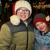 All smiles at the Portadown Christmas lights switch on on Saturday night are Noah Robinson (8) and Demi-lee Wells (6). PT48-200.