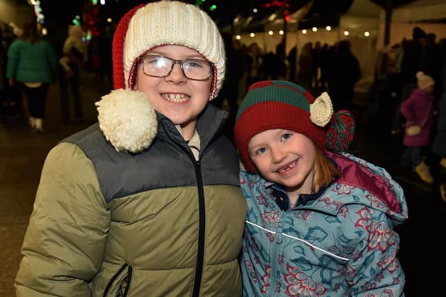 All smiles at the Portadown Christmas lights switch on on Saturday night are Noah Robinson (8) and Demi-lee Wells (6). PT48-200.