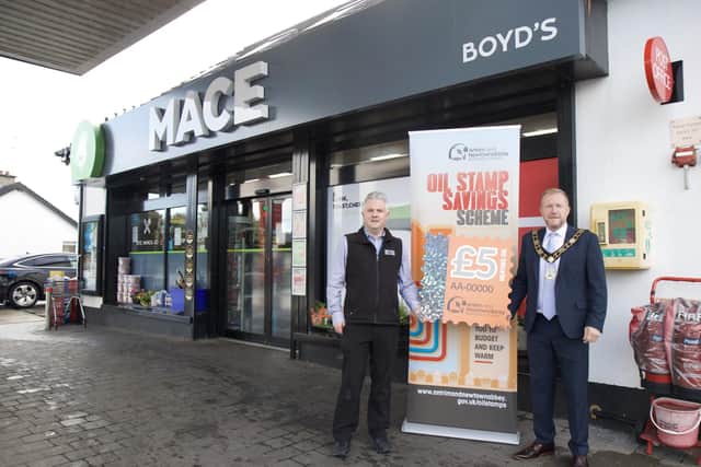 Mayor of Antrim and Newtownabbey, Ald Stephen Ross with Tony Boyd from Boyd’s Mace in Toome who recently became a new participating oil supplier for the Oil Stamp Saving Scheme.