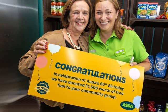 Asda Strabane surprises Strabane Community Project with a lucky Golden Ticket for £1,500 worth of free fuel. Pictured are Ursula Doherty (left) and Emma Kelly (right)