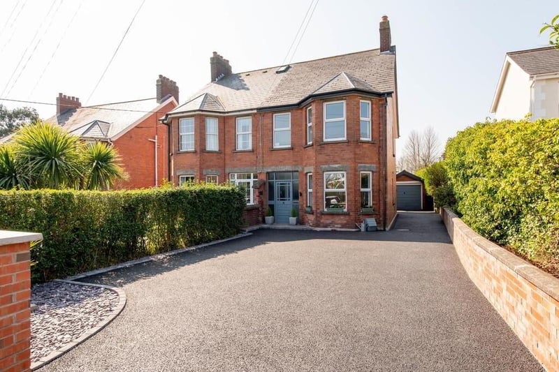 Front of the property with generous car parking.