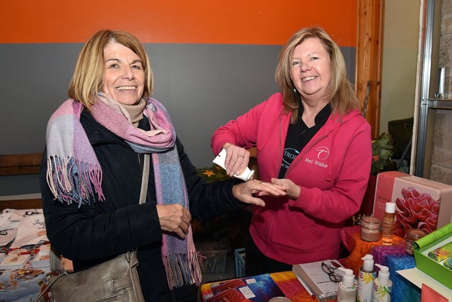 Pictured at the Knitted Knockers of Northern Ireland Christmas market at Brownlow House are Marian Murtagh, left, and Mel Walker of Tropic Skincare. PT51-200.