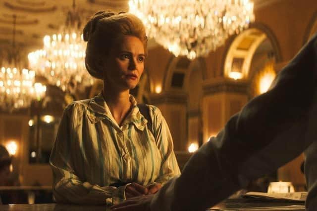 Jayne Wisener as Miss Malloy ordering drink. Credit Unsinkable Movie 2024