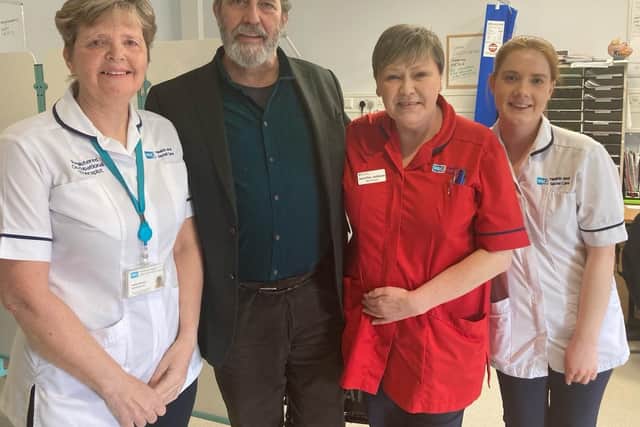 Ciaran Hinds pictured with Whiteabbey Hospital staff.