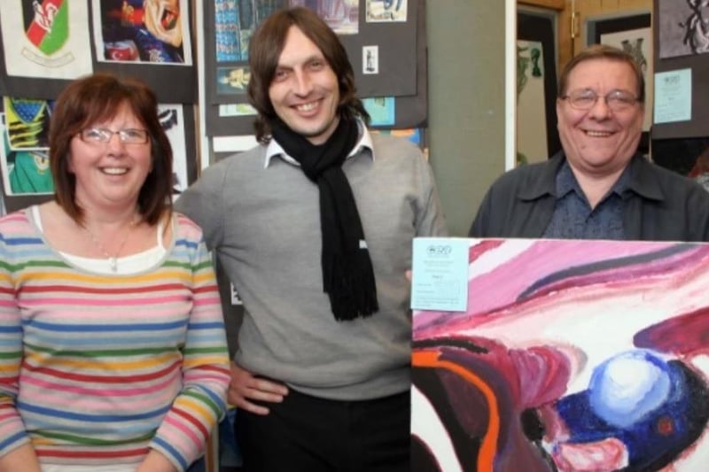 Mr Gary Armstrong (centre), art teacher in Newtownabbey Community High School along with Brenda Doherty and Billy Snoddy of the Board Govenors along with some of Glen Wilkinson's GCSE Art and Design coursework in 2007.