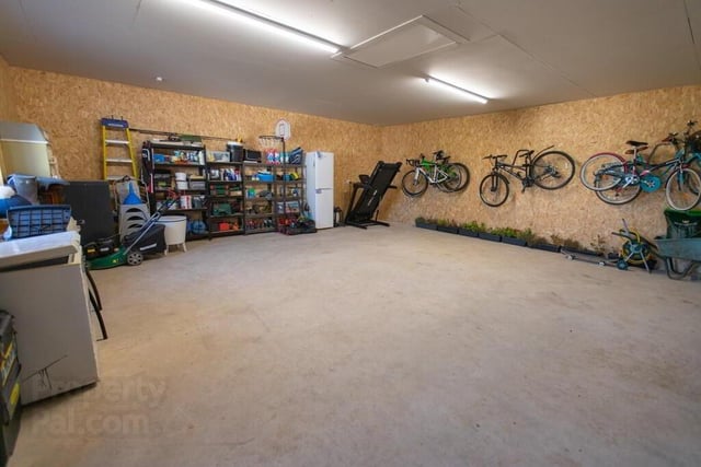 The double garage has plenty of storage space and features electric doors.