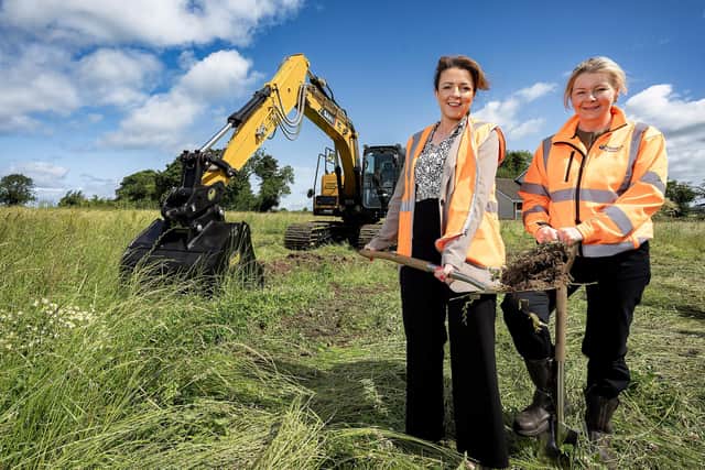 Minister Kimmins is pictured with Translink’s Head of Property Management and Project Delivery Michelle Alcorn cutting the first sod for the new Moira Park and Ride facility. Pic credit: DfI