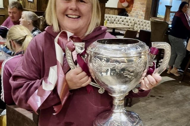 Deputy Mayor of Causeway Coast and Glens Council, Cllr Margaret Anne McKillop, with the Volunteer Cup celebrating Ruairi Og's victory in the Antrim Senior Hurling final