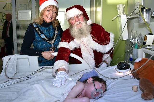 Lord Mayor of ABC Council, Alderman Margaret Tinsley  and Santa pitured with JJ Doran (5) from Gilford during their visit to Blossom Unit at Craigavon Area Hospital.