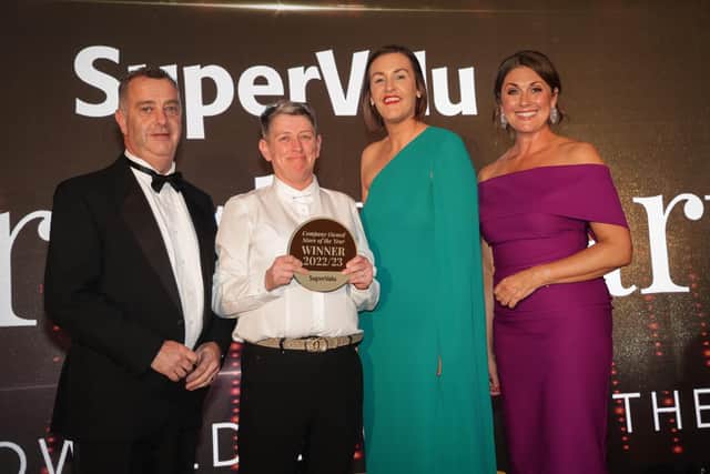 Representing SuperValu Portstewart, Cathie Carton collects the award for SuperValu Company Owned Store of the Year, for the second year running. She is joined by from left, Mark Hewitt from category sponsor Kerry Foods, Caroline Rowan, Head of Retail Operations for Musgrave NI, and host Sarah Travers.