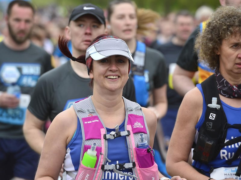 This runner had a smile for a photographer along the route.