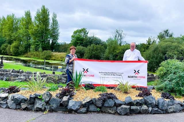 Una Johnston, Company Secretary for TIDAL with Jonathan Gault, Area Sales Manager for  Northstone Materials Ltd, who kindly donated the stone used for the rockery.