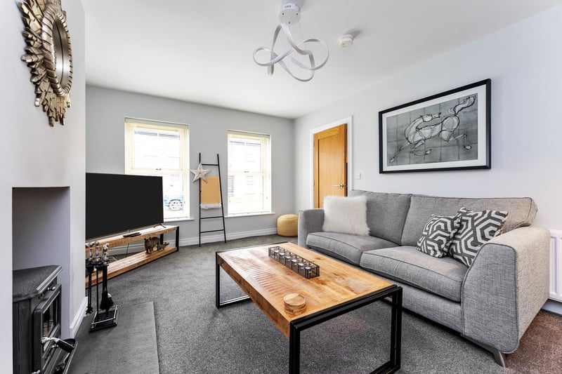 Enjoy cosy evenings in around the feature stove in the attractive living room.