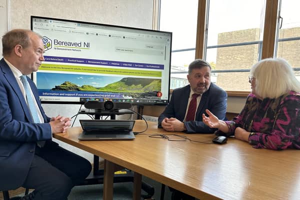From left: Professor Sir Michael McBride, Chief Medical Officer; Robin Swann, Health Minister, and Dr Patricia Donnelly OBE, Chair of the NI Bereavement Network, discuss the new Bereavement NI website. Photo submitted by the Department of Health