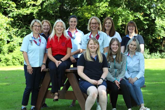 Volunteer guide leaders from Co Armagh join the Girlguiding Ulster executive team to discuss the latest research which reveals girl’s happiness is at an all-time low.  Back row , from left: Elaine Doran, Jill Gardiner, Claire Flowers, Lynn Morrow, Debbie McDowell, Emma Kernohan, Tracey Braziel. Front row:  Zoe Smyth, Abby Haire, Milly Greer. Picture: Phil Smyth