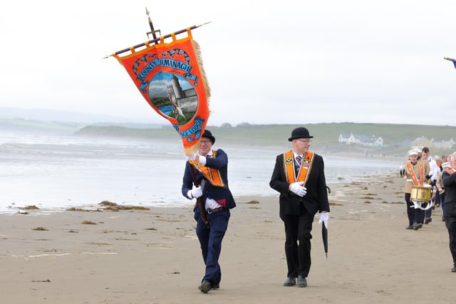 Enjoying a parade along the beach.