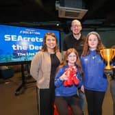 Students from Kilmoyle Primary School have been crowned the winners of its Dream Space Minecraft Education competition.  Back row from left: Amanda Jolliffe, Dream Space lead at Microsoft Ireland;  Matty Davidson Dream Space Learning Specialist at W5 Belfast, and Simon Gibson, Belfast Harbour. CREDIT MICROSOFT