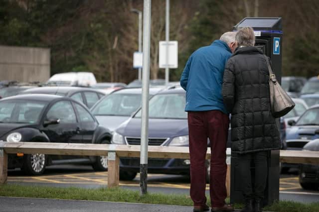 People use a parking payment machine in a car park. Picture: Matt Cardy / Getty Images.
