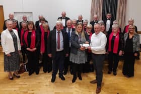 NI Children's Hospice representative Leanne Dawson receives a cheque from the Bushmills and District Bowling League. Credit D Stirling
