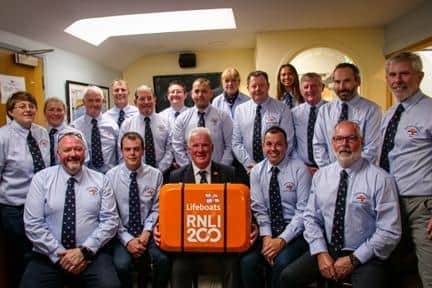 The Portrush RNLI crew with the scroll. Credit Portrush RNLI