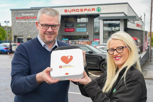 Paul Patterson, Store Manager and Community Representative, Ashlee Gribbin from Eurospar Moundview in Dromore are pictured with the newly installed Automated External Defibrillator at the Hillsborough Road store.