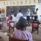 ​Chloe (wearing the white hat) helped plan lessons for the kids in the local school.