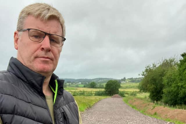 Councillor Mark Robinson, standing on 500 metres of lane built to access the new A5 road. Photo: Mark Robinson