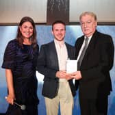 Darren Workman receiving his award from Steve Morrow, Sales Director Staffline sponsor of Young Entrepreneur of the Year along with host Sarah Travers. Pic: Kelvin Boyes/ PressEye