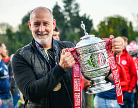 Gary Haveron pictured with the Gibson Cup after their 2025/26 title triumph