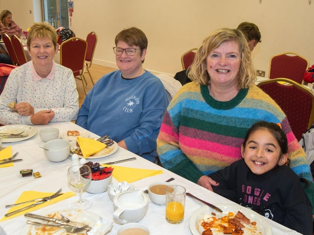 Smiling for the camera are from left, Evelyn Smyton, Lynette Harbinson, Griania White and Bella Pervez.