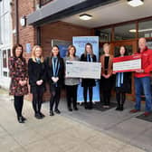 Portadown College representatives hand over cheques to FND Matters NI and Air Ambulance NI. A grand total of £2840 was raised through a Christmas Gift and Craft Fayre held in the school in December.