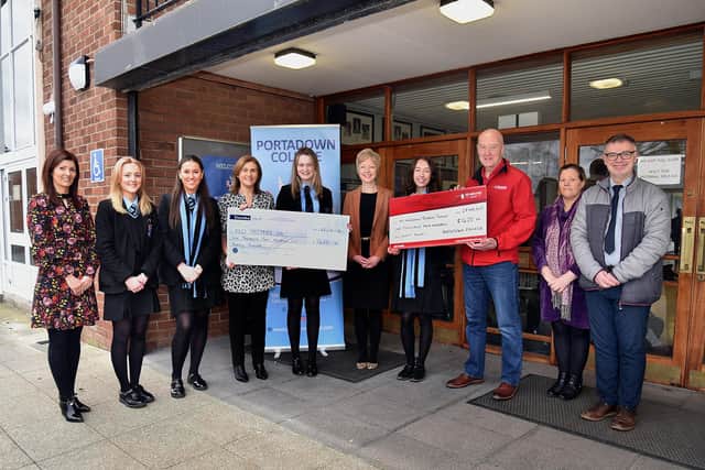 Portadown College representatives hand over cheques to FND Matters NI and Air Ambulance NI. A grand total of £2840 was raised through a Christmas Gift and Craft Fayre held in the school in December.