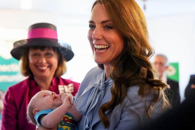 The Princess of Wales with one of the youngest well-wishers in Carrickfergus. Picture by Jonathan Porter/PressEye