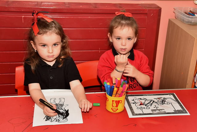 Having fun colouring in at Ashgrove Playgroup are Farrah, left, and Isla-Rose. PT99-211,