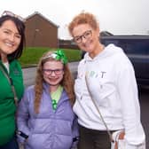 Heading for the Tír Na nÓg GFC St Patrick's Day Party on Sunday afternoon are from left, Jenny Madden, Isla McClean (8) and mum  Louise. PT12-234.