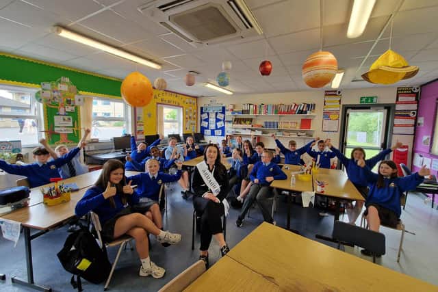 Armagh Rose Erin McCormac with some of her pupils who are P7 at St Anthony's Primary School in Craigavon, Co Armagh. Erin will be heading to the Rose of Tralee this summer to represent Co Armagh.