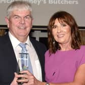 Winner of the Lifetime Achievement Award at the 2022 Mid Ulster Business Awards, Oran McAtamney owner of McAtamney's Butchers with Julie McKeown, of main sponsors, Henry Brothers. MU46-220