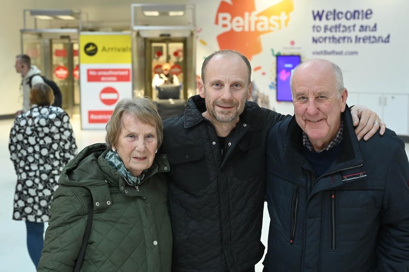 Paul Buckley pictured meeting his mum Patricia and dad Trevor arriving home from Leeds for Christmas at George Best Belfast City Airport.