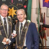 Neil McCarthy receiving a 40-year service jewel from Bryan Gamble, Worshipful Master of Largymore Star of the North RBP 198, prior to the lodge leaving for the Co Down Grand Chapter parade in Dromore on Saturday.