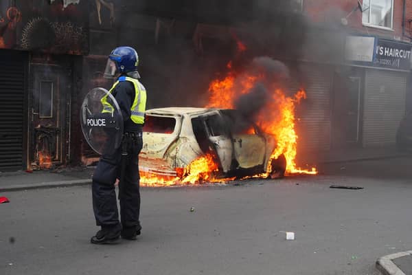 A car burns on Parliament Road, in Middlesbrough, during an anti-immigration riot. Credit: Owen Humphreys/PA Wire