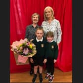 Celebrating the retirement of Elizabeth (Betty) McCreery, who was Secretary in Donacloney Primary School since August, 2016. Included in the photo are Mrs McCreery and Miss Nesbitt (principal) with pupils Daniel Arnold and Matilda Morgan.