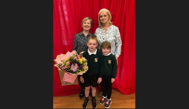 Celebrating the retirement of Elizabeth (Betty) McCreery, who was Secretary in Donacloney Primary School since August, 2016. Included in the photo are Mrs McCreery and Miss Nesbitt (principal) with pupils Daniel Arnold and Matilda Morgan.
